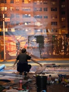 Artist installing inside the New York room