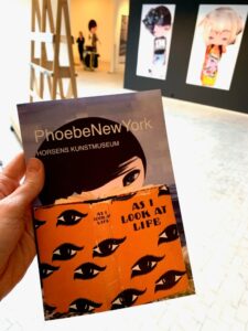 Holding the exhibition pamphlet
